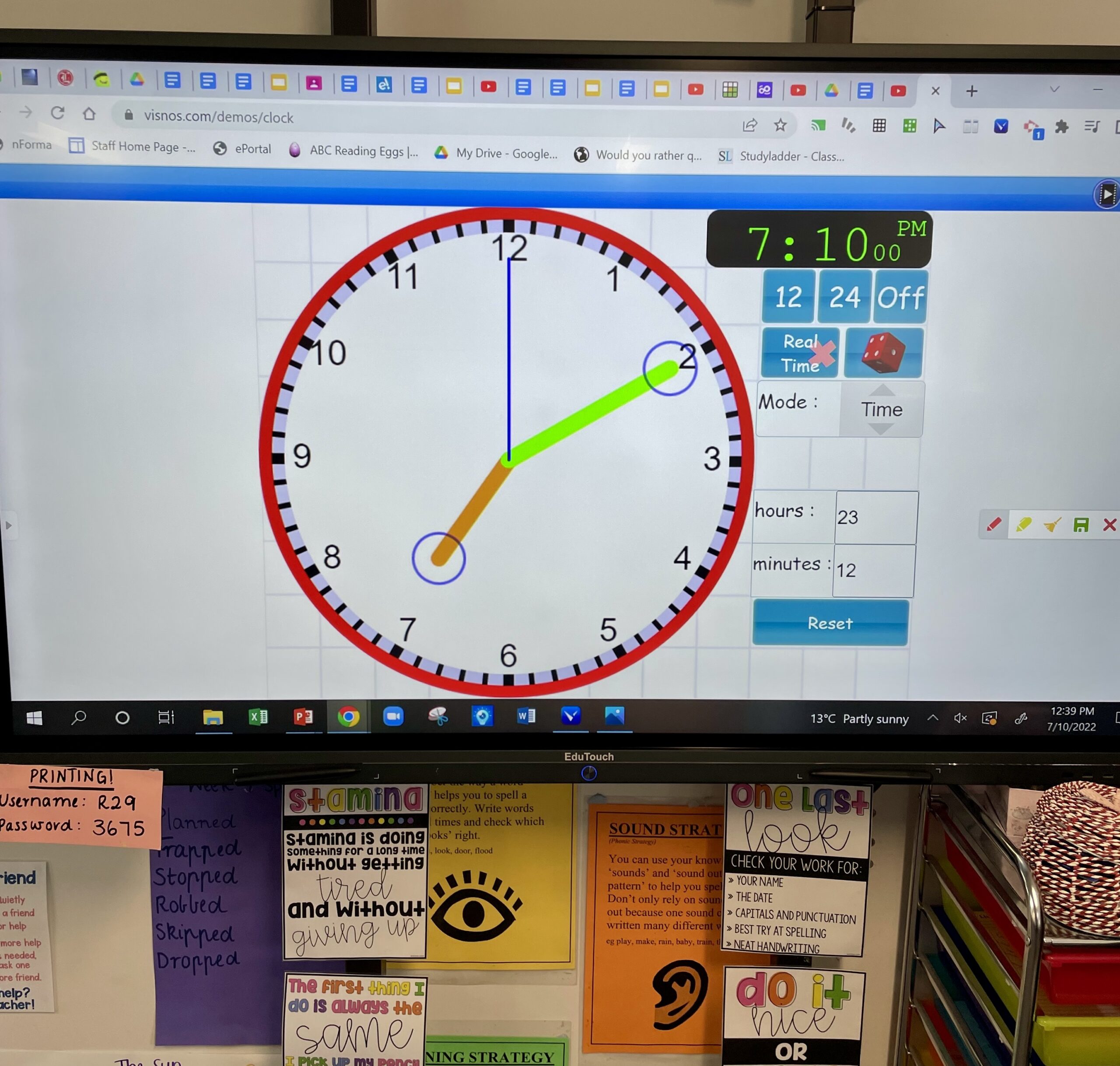 Flat panel display in a primary school classroom displaying a clock and timer to keep students on track.
