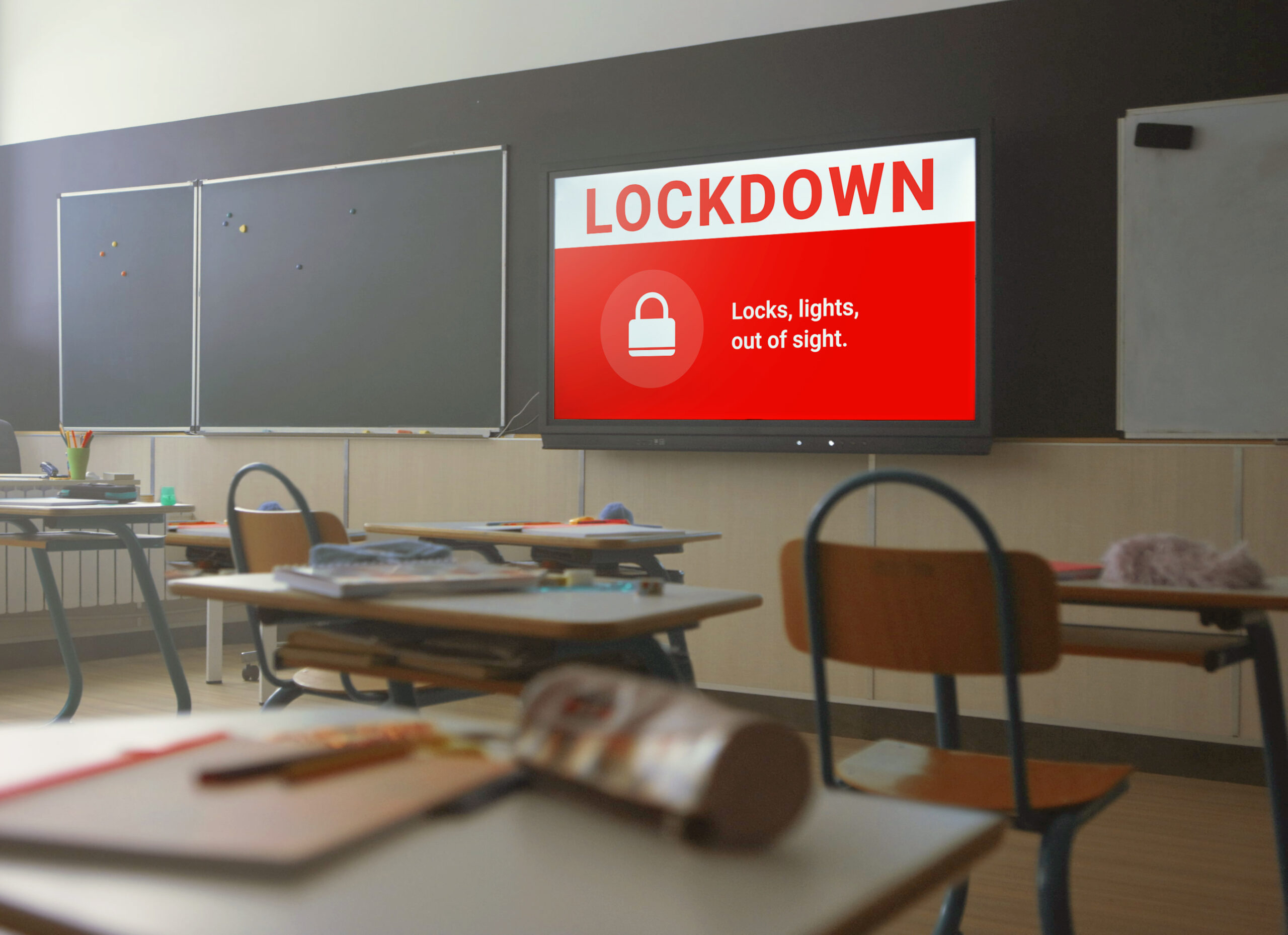 unlock safety upgrades: indiana's school funding opportunity 1 Classroom with emergency lockdown notification displayed on screen.