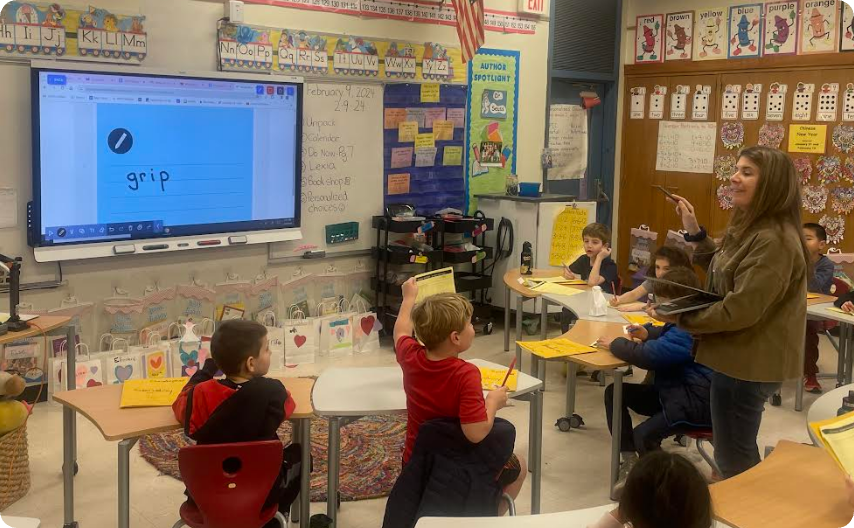 Teacher moving around the classroom. 